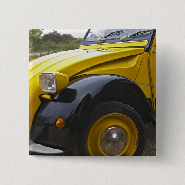 An old black and yellow Citroen 2CV 2 CV, 2 Inch Square Button (Front)