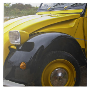 An old black and yellow Citroen 2CV 2 CV, Tile