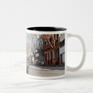 An old car rusty and flaky colour parked in the Two-Tone coffee mug