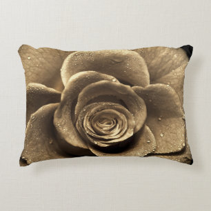 An old-fashioned rose close up, wet with water dro accent pillow