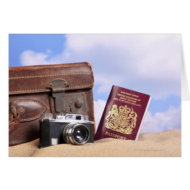 An old leather suitcase, retro camera and (Front Horizontal)