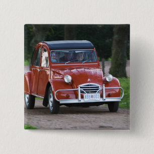 An old red Citroen 2CV car with a smiling woman 2 Inch Square Button