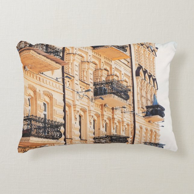 An old yellow house with wrought-iron balconies. f accent pillow (Front)
