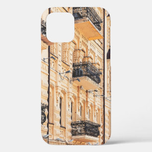 An old yellow house with wrought-iron balconies. f iPhone 12 case