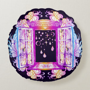 An open vintage window with pendants against a bac round pillow
