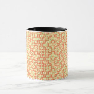 an orange and white background with a pattern mug