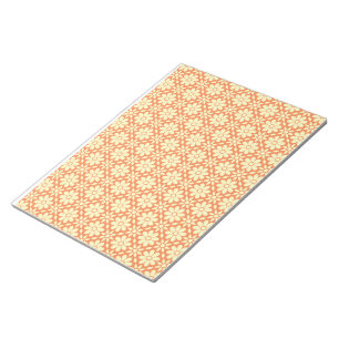 an orange and white background with a pattern notepad