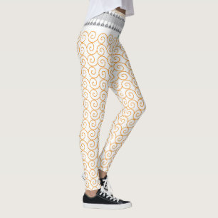 an orange and white background with swirls leggings