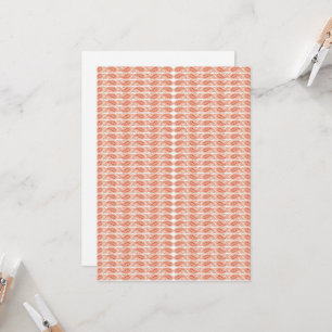 an orange and white pattern on a white background invitation