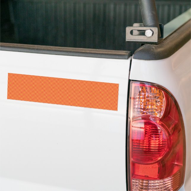 an orange and yellow background with small squares bumper sticker (On Truck)