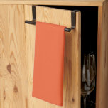 an orange background with a kitchen towel<br><div class="desc">The design is a large,  bright orange square with a uniform colour and a smooth texture. The orange hue is consistent throughout the square,  creating a vibrant and warm atmosphere.</div>