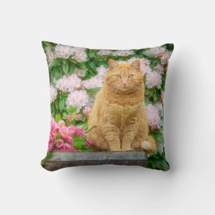 An Orange Cat in a Garden with Pink Spring Flowers Throw Pillow