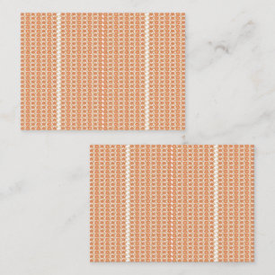 An orange rug with a textured pattern lies flat on appointment card