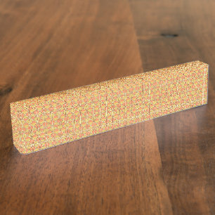 An orange, yellow, and brown symmetrical pattern w nameplate