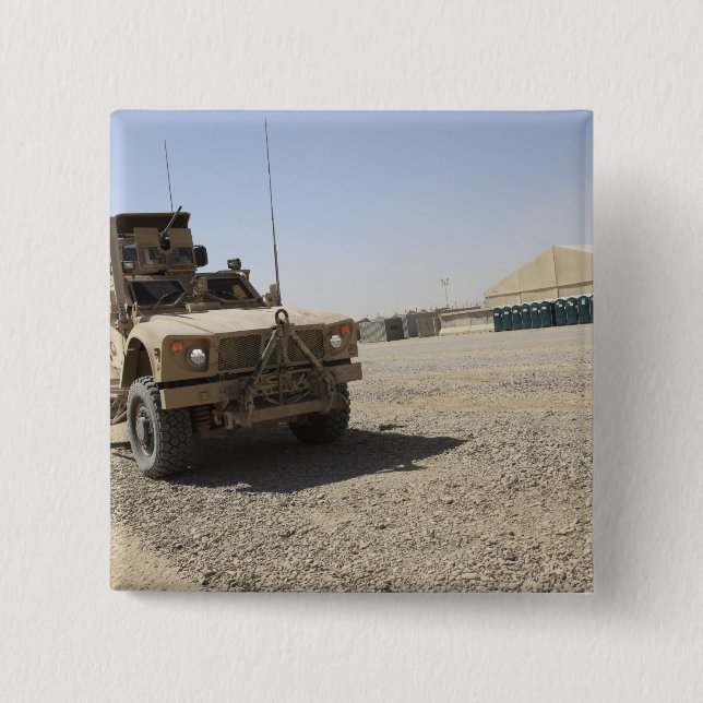 An Oshkosh M-ATV 2 Inch Square Button (Front)