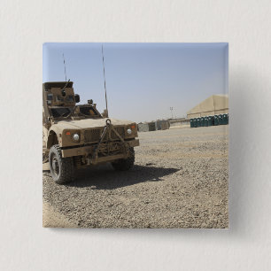 An Oshkosh M-ATV 2 Inch Square Button