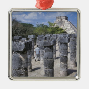Ancient Stone pillars in Chichen Itza. Central Metal Ornament