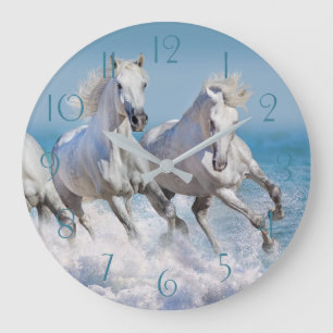 Andalusian white horses run in the waves large clock