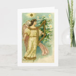 Angel with harp at Christmas tree card