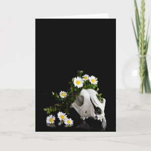 Animal skull with a wreath of wild flower holiday card