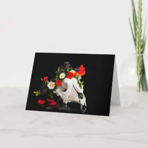 Animal skull with a wreath of wild flower holiday card