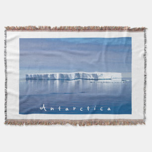Antarctica iceberg landscape photo with white text throw blanket