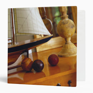 Antique Baseballs On A Table By A Model Sailboat Binder