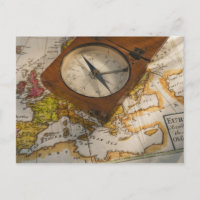 Antique compass on map