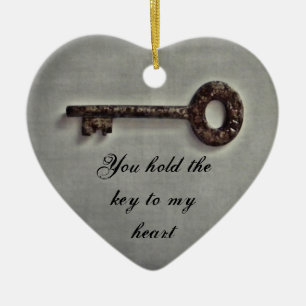 Antique key on grey ceramic ornament