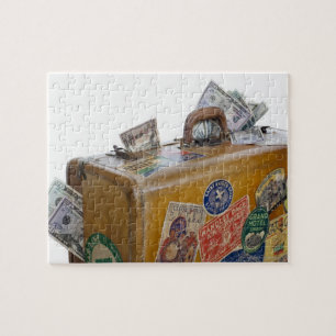 Antique suitcase with protruding money jigsaw puzzle