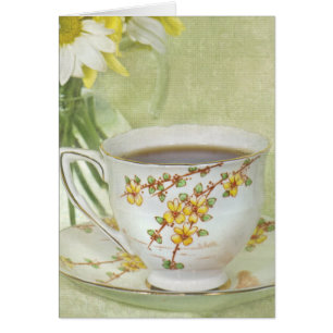 antique teacup with daisy bouquet
