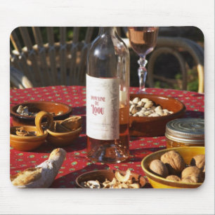 Aperitif and appetizers prepared: bread, olives, mouse pad