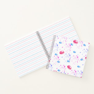 Appetizing macarons in watercolor splatters notebook