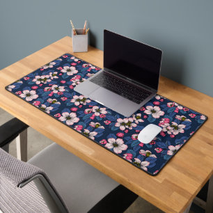 Apple blossom on a dark blue desk mat