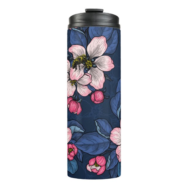 Apple blossom on a dark blue thermal tumbler (Front)