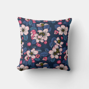 Apple blossom on a dark blue throw pillow