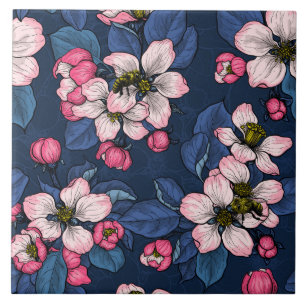 Apple blossom on a dark blue tile