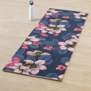 Apple blossom on a dark blue yoga mat