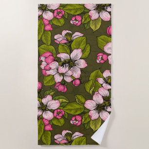 Apple blossom on dark green beach towel