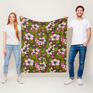 Apple blossom on dark green fleece blanket