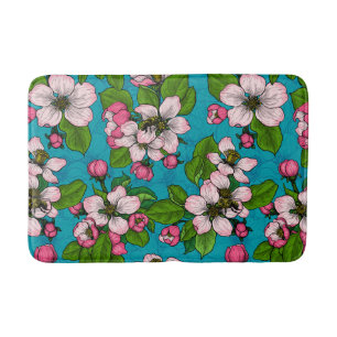 Apple blossom on turquoise bath mat