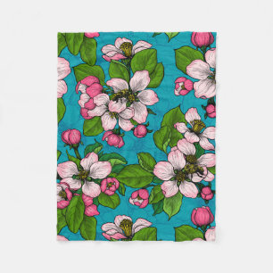 Apple blossom on turquoise fleece blanket