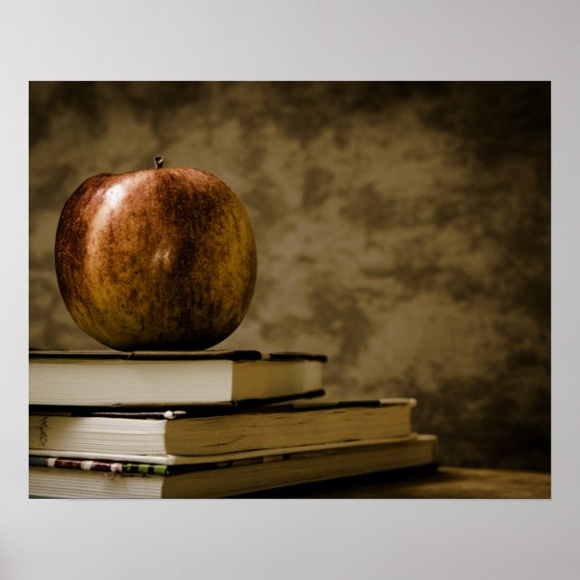 Apple on Top of a Stack of Books on a Desk Poster (Front)