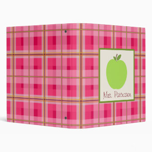 Apple vert et classeur rose de professeur de plaid