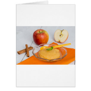 Applesauce with cinnamon and orange spoon