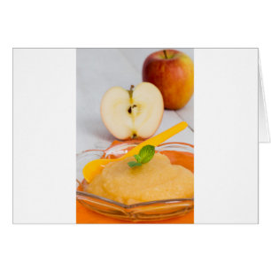 Applesauce with cinnamon and orange spoon