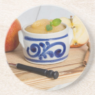 Applesauce with cinnamon in stoneware bowl coaster