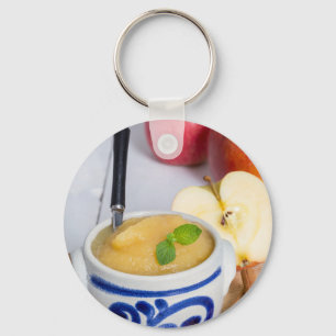 Applesauce with cinnamon in stoneware bowl keychain