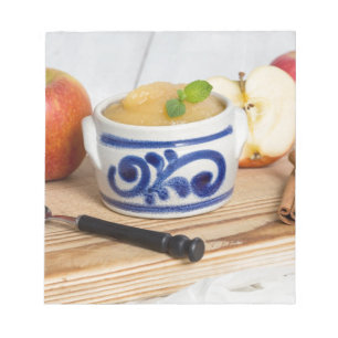 Applesauce with cinnamon in stoneware bowl notepad