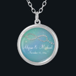 Aqua Infinity Symbol Sign Infinite Love Twinkling Silver Plated Necklace<br><div class="desc">COLOR PALETTE: aqua blue and sky blue with rainbow touches. DESIGN COLLECTION: Matching the wedding invitation set of the same name. Perfect for spring or winter weddings with its shimmery, sparkling, twinkling lights sparkle off graphically created jewels in a modern Infinity Sign motif. A Shimmer of rainbow light illuminates the...</div>
